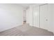Bedroom featuring neutral carpet, closet and door, and ample natural light at 4312 E Bradford Ave, San Tan Valley, AZ 85143