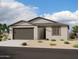 Single-story home with brown garage door and light-colored exterior at 4312 E Bradford Ave, San Tan Valley, AZ 85143