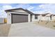 Attractive single-story home with a gravel front yard and a convenient two-car garage at 4312 E Bradford Ave, San Tan Valley, AZ 85143