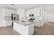 Beautiful kitchen with white cabinets, stainless steel appliances, and a large center island at 4312 E Bradford Ave, San Tan Valley, AZ 85143