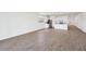 Spacious, light-filled open living space with tile floors seamlessly flowing into the kitchen area at 4312 E Bradford Ave, San Tan Valley, AZ 85143
