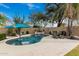 Stunning kidney shaped pool with a patio and water feature at 4411 E Spur Dr, Cave Creek, AZ 85331