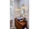 Stylish bathroom with patterned wallpaper and a unique vessel sink at 4802 N 46Th St, Phoenix, AZ 85018