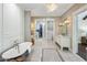 Elegant bathroom with soaking tub, walk-in shower, and double vanity at 4802 N 46Th St, Phoenix, AZ 85018