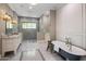 Spa-like bathroom with soaking tub, walk-in shower, and dual vanities at 4802 N 46Th St, Phoenix, AZ 85018