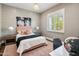 Cozy bedroom with a queen-size bed and a workspace at 4802 N 46Th St, Phoenix, AZ 85018