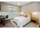 Charming bedroom with a queen-size bed and wood floors at 4802 N 46Th St, Phoenix, AZ 85018