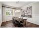 Elegant dining room with a large dark wood table and statement art at 4802 N 46Th St, Phoenix, AZ 85018