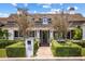 Front view of a charming farmhouse with walkway and lush landscaping at 4802 N 46Th St, Phoenix, AZ 85018