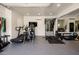 Modern home gym featuring a treadmill and elliptical at 4802 N 46Th St, Phoenix, AZ 85018