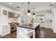 Bright kitchen with white cabinets, an expansive island, and high-end appliances at 4802 N 46Th St, Phoenix, AZ 85018