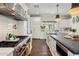 Spacious kitchen featuring a large island, stainless steel appliances, and white cabinetry at 4802 N 46Th St, Phoenix, AZ 85018