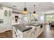 Open kitchen with island, sink, and a view into the adjacent living room at 4802 N 46Th St, Phoenix, AZ 85018