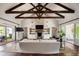 Spacious living room with exposed beams, fireplace, and hardwood floors at 4802 N 46Th St, Phoenix, AZ 85018