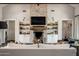 Living room with a large brick fireplace and built-in shelving at 4802 N 46Th St, Phoenix, AZ 85018