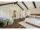 Bright main bedroom with ensuite bathroom and hardwood floors at 4802 N 46Th St, Phoenix, AZ 85018