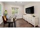 Bright home office featuring a large desk and built-in media console at 4802 N 46Th St, Phoenix, AZ 85018
