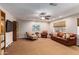 Spacious basement with leather sofas and a TV at 5535 E Sheena Dr, Scottsdale, AZ 85254