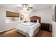 Bedroom with a double bed and ceiling fan at 5535 E Sheena Dr, Scottsdale, AZ 85254