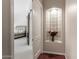 Bedroom hallway with decorative niche and access to bedroom at 5535 E Sheena Dr, Scottsdale, AZ 85254
