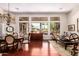 Formal dining room with hardwood floors, chandelier, and large windows at 5535 E Sheena Dr, Scottsdale, AZ 85254