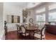 Bright dining room with hardwood floors, chandelier, and ample seating at 5535 E Sheena Dr, Scottsdale, AZ 85254