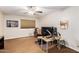 Bright home office features built-in desk, comfortable chair, and ample space at 5535 E Sheena Dr, Scottsdale, AZ 85254