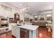 Open concept kitchen with stainless steel appliances and a large island at 5535 E Sheena Dr, Scottsdale, AZ 85254