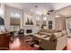 Large living room with hardwood floors, fireplace, and lots of natural light at 5535 E Sheena Dr, Scottsdale, AZ 85254