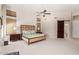 Bright main bedroom with king-size bed and sliding barn door at 5535 E Sheena Dr, Scottsdale, AZ 85254