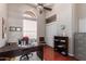 Home office with built-in shelving and wood floors at 5535 E Sheena Dr, Scottsdale, AZ 85254