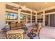 Relaxing covered patio with comfortable seating and ceiling fans at 5535 E Sheena Dr, Scottsdale, AZ 85254