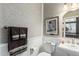 Elegant powder room with white sink and patterned wallpaper at 5535 E Sheena Dr, Scottsdale, AZ 85254