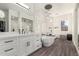 Spa-like bathroom featuring a freestanding bathtub and walk-in shower at 7130 W Rowel Rd, Peoria, AZ 85383