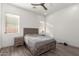 Well-lit bedroom with a bed and two night stands at 7130 W Rowel Rd, Peoria, AZ 85383