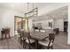 Open concept dining room with large table and kitchen view at 7130 W Rowel Rd, Peoria, AZ 85383