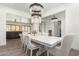 Elegant dining room with a large table and stunning chandelier at 7130 W Rowel Rd, Peoria, AZ 85383