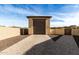 Detached garage with large door and paver driveway at 7130 W Rowel Rd, Peoria, AZ 85383