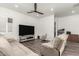 Spacious Gathering room with comfortable seating and a large TV at 7130 W Rowel Rd, Peoria, AZ 85383