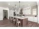 Gourmet kitchen boasts a large island and stainless steel appliances at 7130 W Rowel Rd, Peoria, AZ 85383
