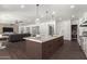 Open concept kitchen with large island and breakfast bar at 7130 W Rowel Rd, Peoria, AZ 85383
