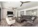 Spacious living room with hardwood floors, fireplace, and large windows at 7130 W Rowel Rd, Peoria, AZ 85383