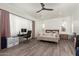 Relaxing main bedroom with sitting area and workspace at 7130 W Rowel Rd, Peoria, AZ 85383