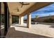 Covered patio overlooks a refreshing pool and spa with a beautiful desert landscape at 7130 W Rowel Rd, Peoria, AZ 85383
