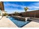 Relaxing pool with built-in spa and spacious patio at 7130 W Rowel Rd, Peoria, AZ 85383