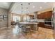 Kitchen with granite island, stainless steel appliances, and wood cabinets at 7848 W Willow Way, Florence, AZ 85132