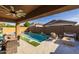 Inviting pool area with patio furniture and fire pit at 10141 E Tamery Ave, Mesa, AZ 85212