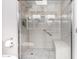 Walk-in shower with pebble floor and built-in seat at 10322 W Manzanita Dr, Sun City, AZ 85373