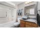 Bathroom with shower/tub combo and wood vanity at 10322 W Manzanita Dr, Sun City, AZ 85373