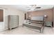 Main bedroom with dresser and light gray bed frame at 10322 W Manzanita Dr, Sun City, AZ 85373